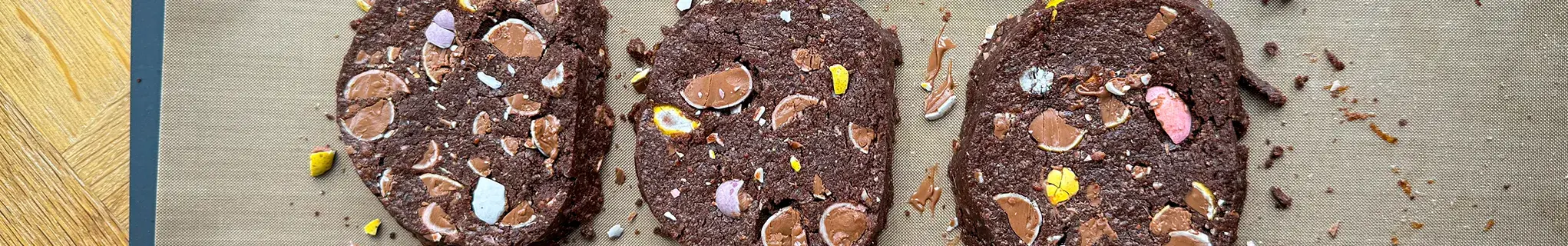 Chocolate mini egg rye cookies on baking tray