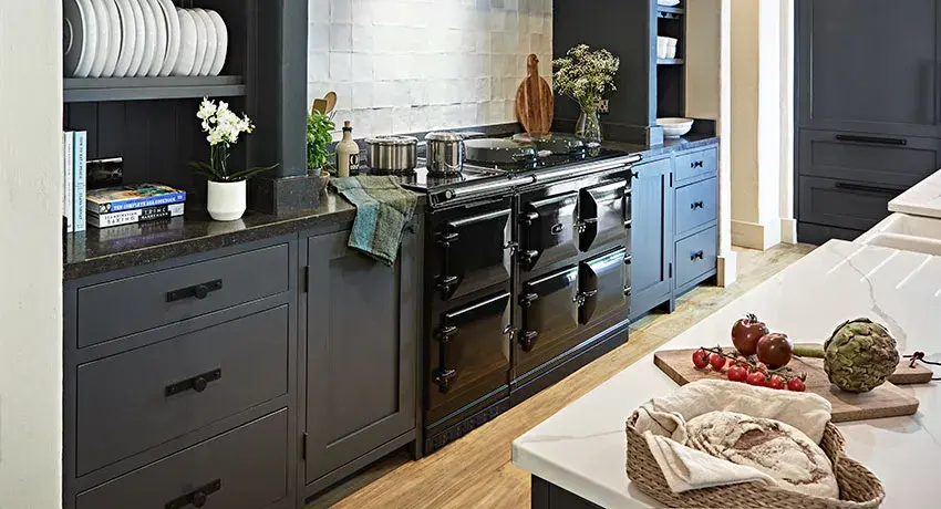 AGA R7 150 in Black with dark blue cabinetry 