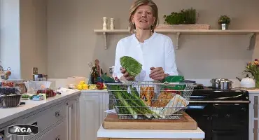 AGA Demonstrator Na Hansell with fresh vegetables