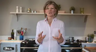 AGA Demonstrator Na Hansell in front of her AGA 