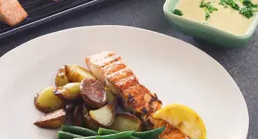 Grilled salmon, potatoes, green beans and a hollandaise sauce
