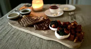 the perfect AGA steak served with potatoes 