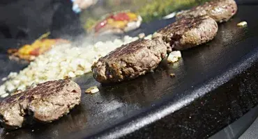 Beef Burgers cooking on the AGA Professional Series Outdoor Grill
