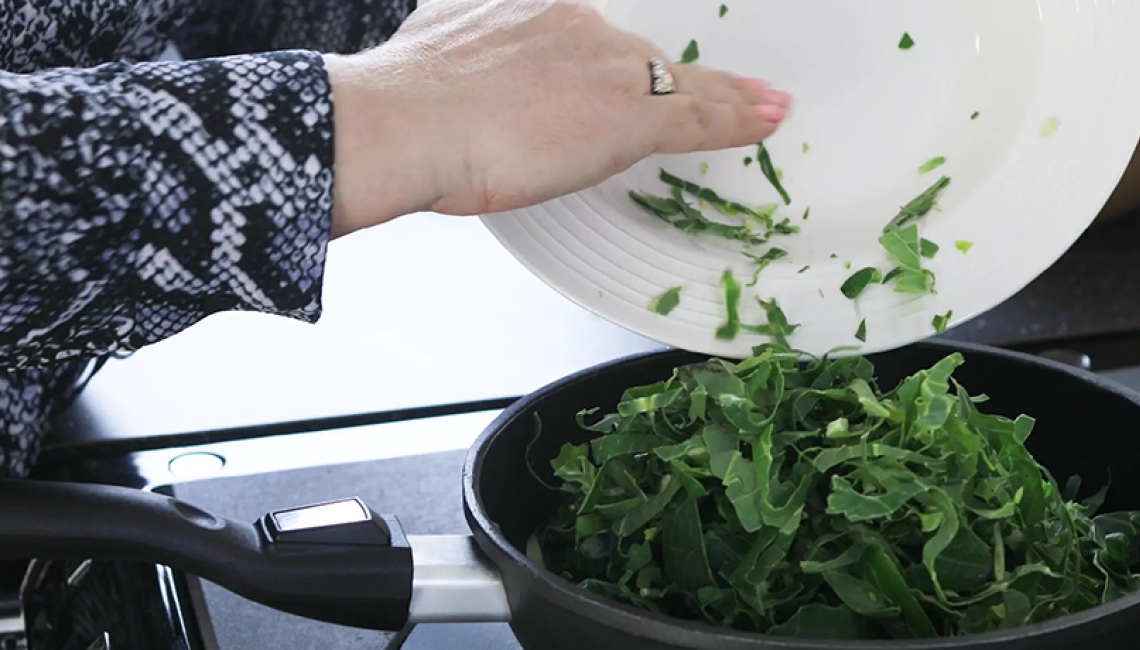 Green vegetables steaming on the AGA hotplate