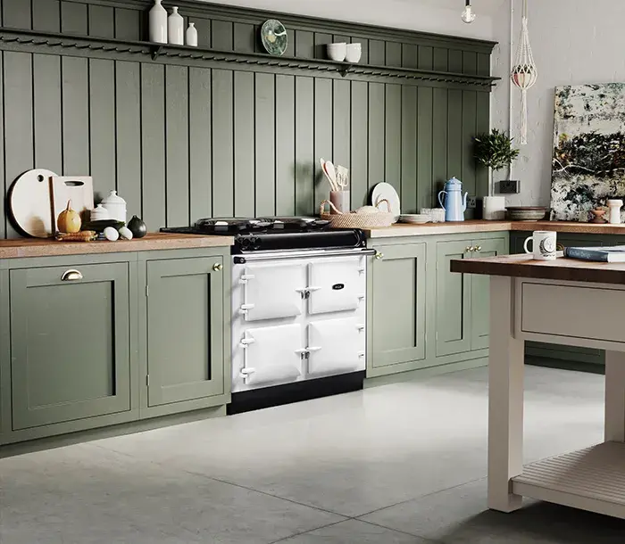 AGA R3 100 model in white in a kitchen with green cabinetry 