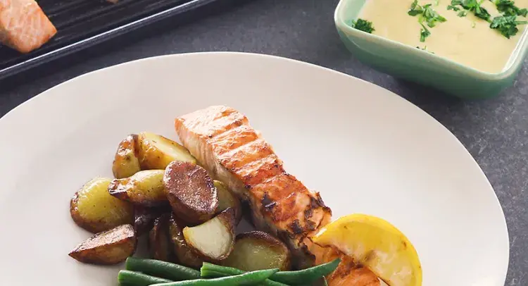 Grilled salmon, potatoes, green beans and a hollandaise sauce