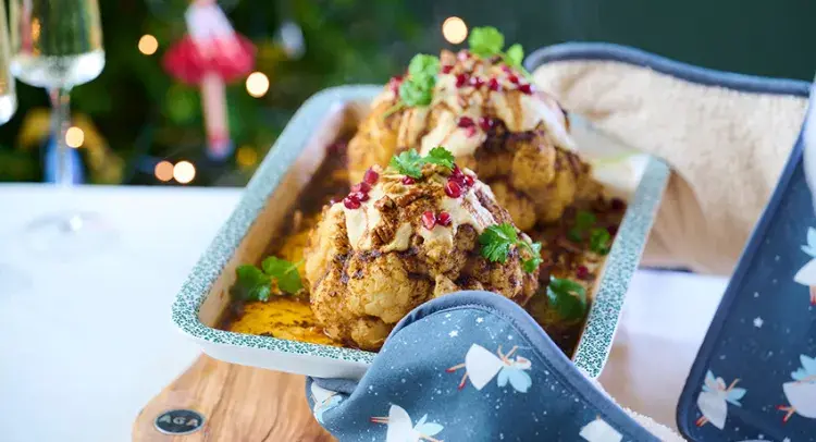Whole Roasted Harissa Cauliflower with Hummus Dressing
