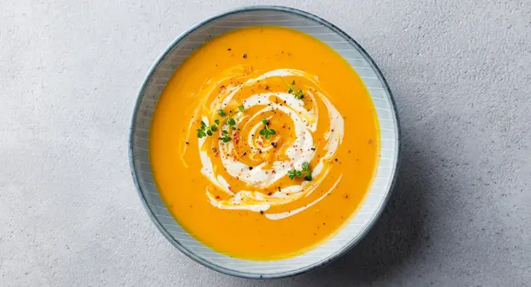 Orange soup in a bowl 